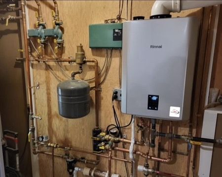 Upgraded Rinnai combi boiler with copper piping, expansion tank and Taco controls