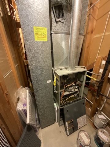 Old gas furnace before full electric heat pump conversion