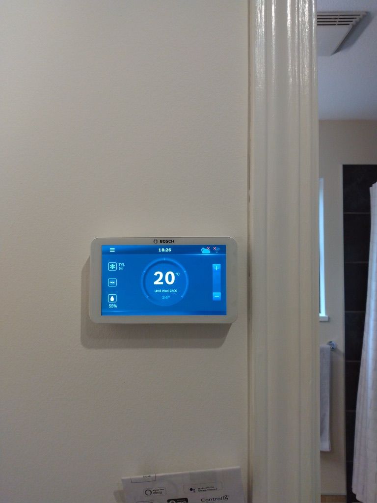 Bosch smart thermostat showing temperature humidity and scheduling controls