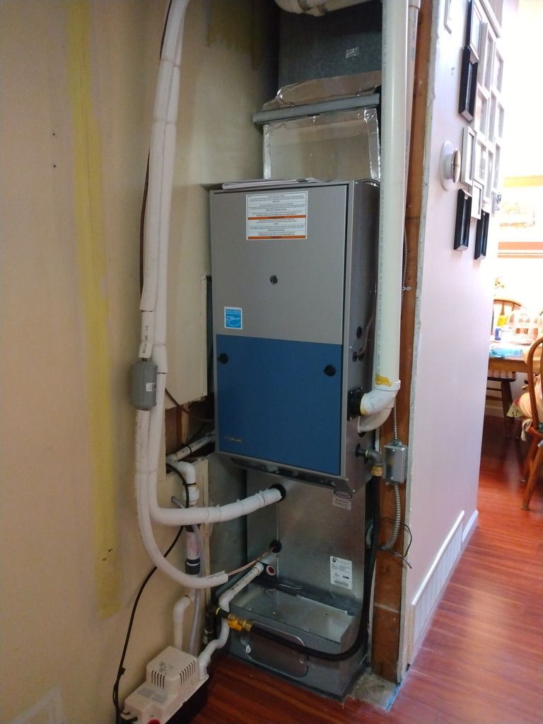 Daikin high-efficiency furnace installed in hallway closet