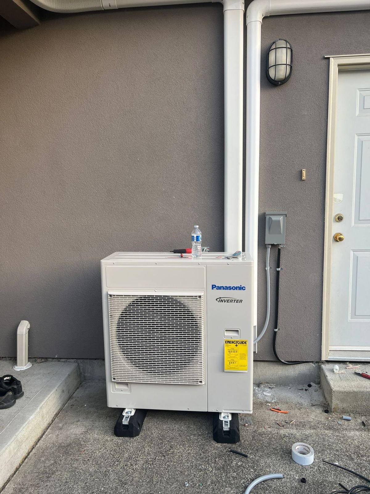 Panasonic inverter ductless mini-split outdoor condenser with line set cover and electrical disconnect — 360 Install Solution