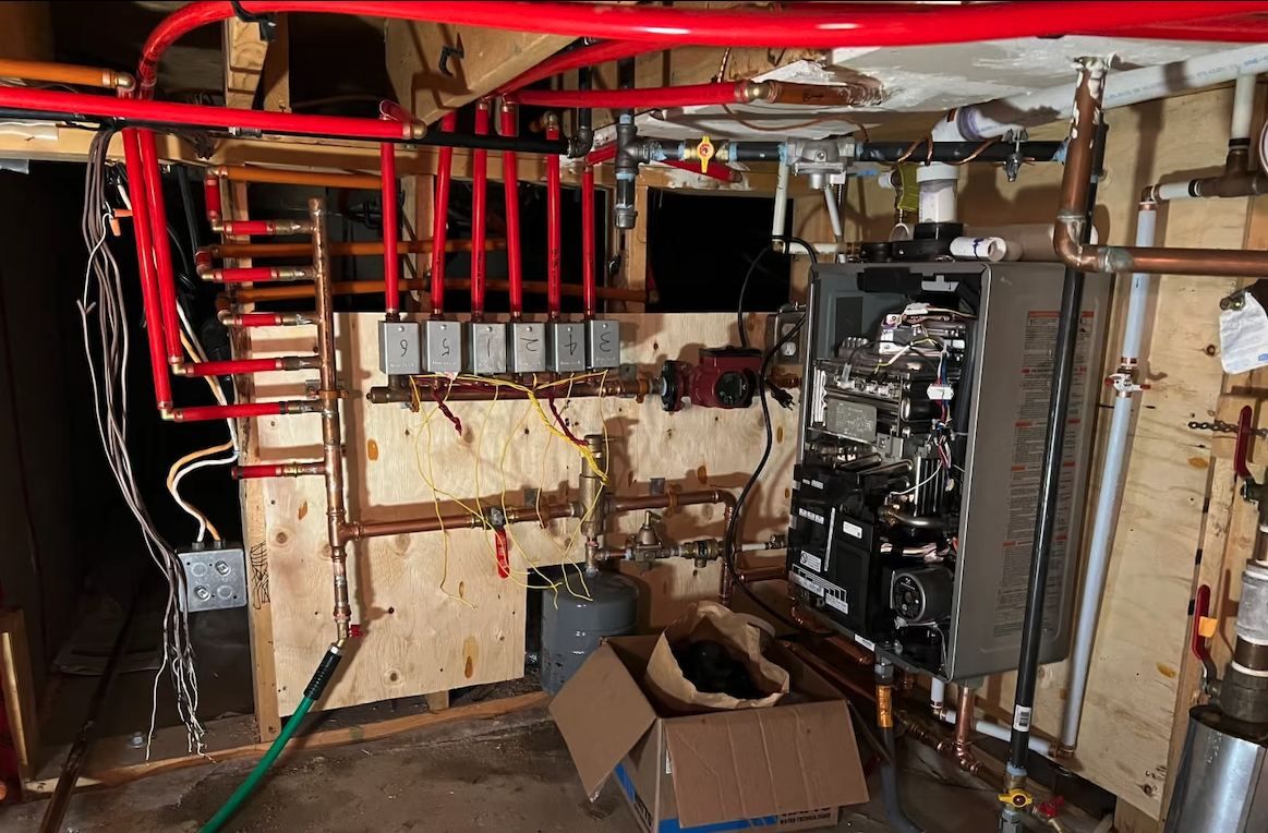 Rinnai boiler with PEX radiant manifold and zone valves during installation
