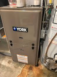 YORK high-efficiency furnace installed in basement utility area